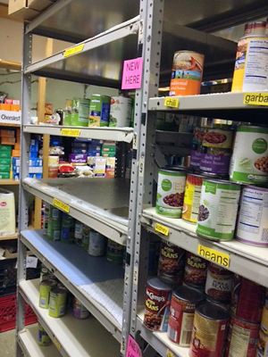 Shelves with cans of food